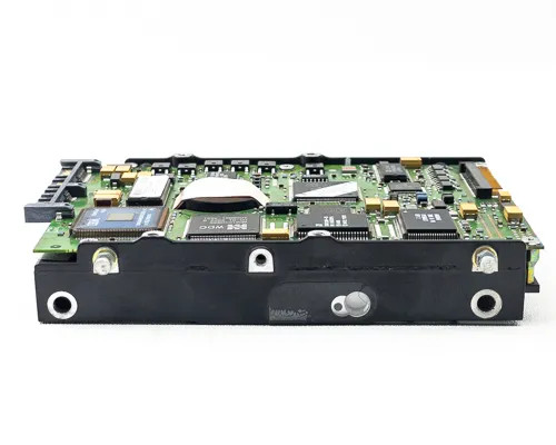 IBM 99F7832 hard drive – bottom edge view showing full PCB with IBM and WDC chips, SAA connector interface, and mounting screws