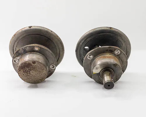 Minply MFW MFO-60 circular safety chuck pair — bottom shaft view showing both shaft stubs and underside patina