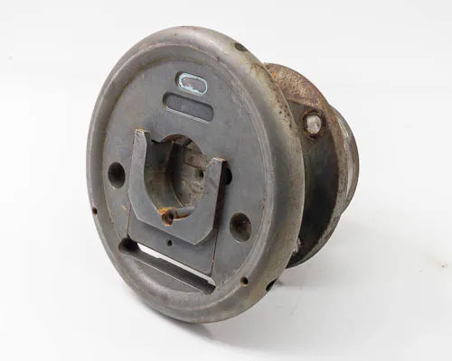 Minply MFO-60 circular safety chuck — three-quarter view showing flange face, drive slot, and shaft with surface rust