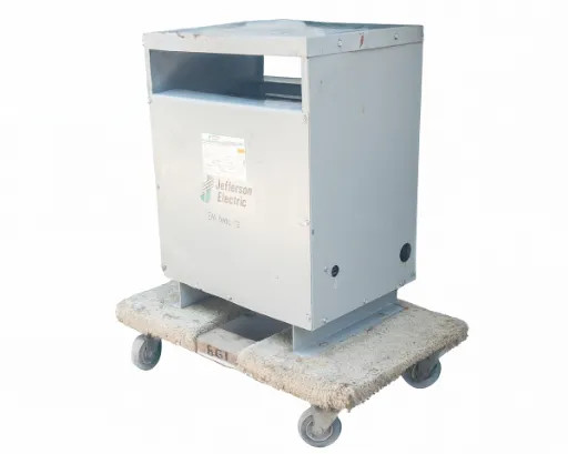 Jefferson Electric 30 kVA transformer – front-right three-quarter view on pallet dolly showing enclosure and ventilation slot