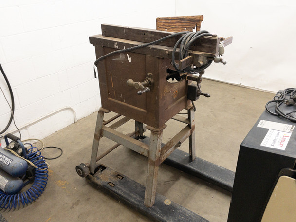 Walker-Turner vintage table saw on wheeled metal stand – front angle view showing table surface and blade guard