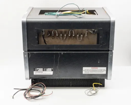 Rear view of Lindberg 54434 Hevi-Duty Tube Furnace showing rear panel with terminal connections, nameplate, warning label, ventilation grille, and loose wiring leads