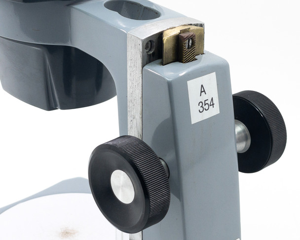 AO 569 arm and focus rack detail showing rack-and-pinion mechanism, focus knob, and asset tag A 354