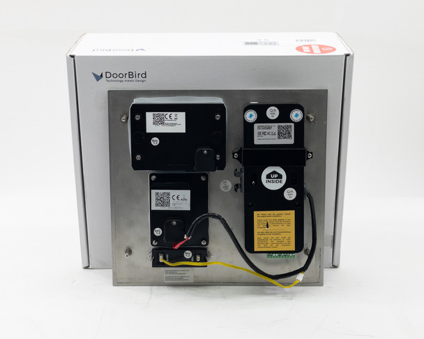 DoorBird D2101iKH V4A rear view showing mounted modules, wiring harness, and yellow relay wires against original box