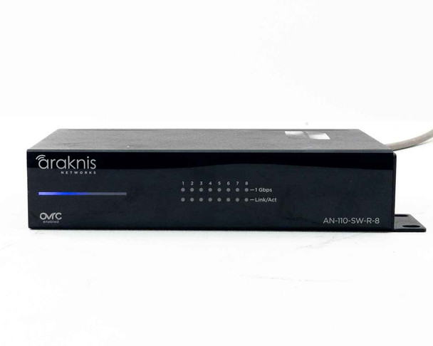 Araknis AN-110-SW-R-8 – rear panel view showing all 8 RJ-45 gigabit ports with green LEDs active, reset button, power cable connected, and label with model and MAC address
