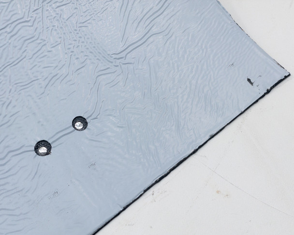 Uni-Solar PVL-116 edge detail – flexible laminate cross-section and adhesive backing