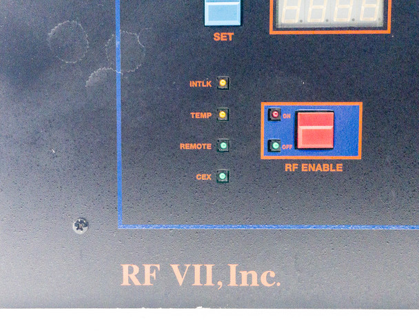 RFVII RF-20-XXVII front panel left section showing INTLK, TEMP, REMOTE, CEX indicator LEDs and RF ENABLE ON/OFF switch with RF VII Inc logo