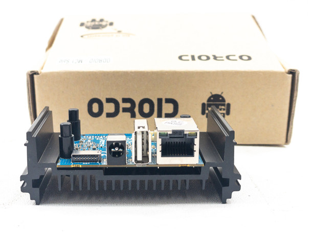Front port view of ODROID-MC1 Solo in heatsink enclosure showing USB 2.0, Gigabit Ethernet RJ-45, and board edge connectors