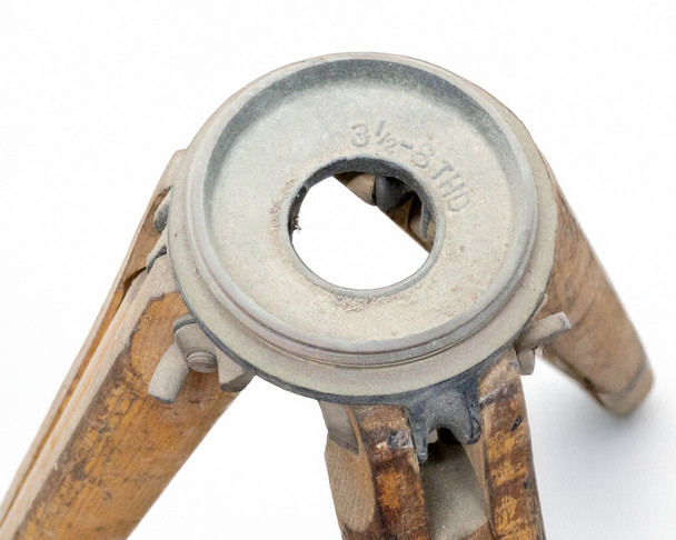 Close-up of cast metal tripod head mount showing 3 1/2-8 THD threaded opening stamped on the rim