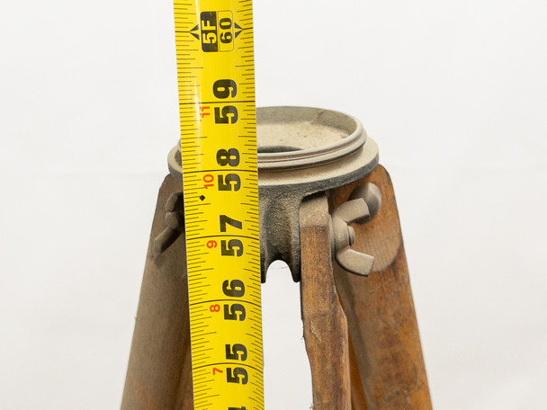 Tape measure shown alongside collapsed tripod legs measuring approximately 59 inches at the head platform level