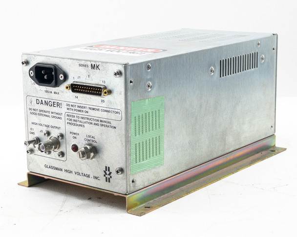 Glassman MK Series power supply three-quarter front-left view showing aluminum enclosure, vented top, and front panel controls with power light on