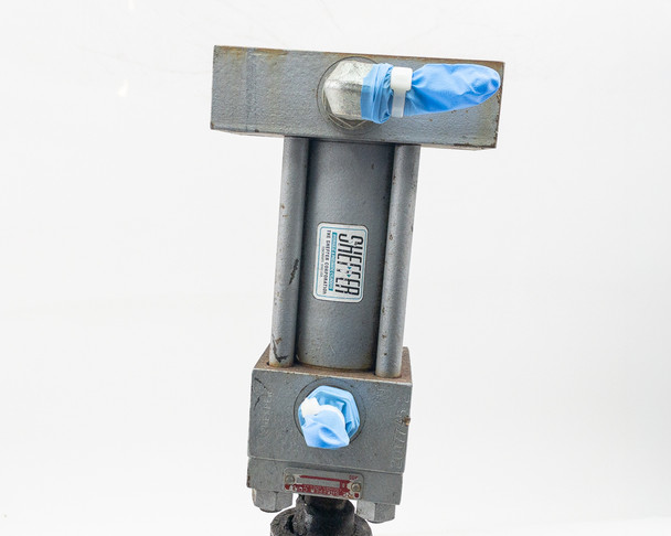 Sheffer 2HHRHF3 hydraulic cylinder top view showing rear head flange, tie rods, and blue protective port cap on rod end