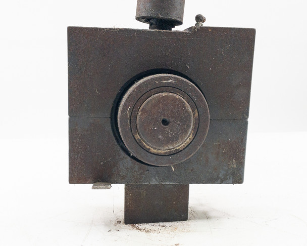 Steel base fixture attached to Sheffer 2HHRHF3 cylinder — front face showing circular recessed bore opening with heavy wear and surface oxidation