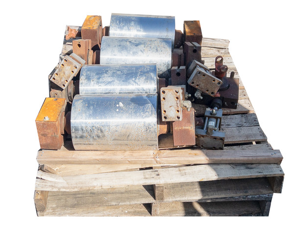 Full pallet view of conveyor drum lot from above showing drums, brake blocks, and mounting hardware