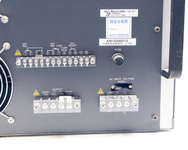 Takasago BWS 40-15 rear panel lower detail showing output sense terminal block, AC input voltage terminal block labeled 100V 50/60Hz, and fuse