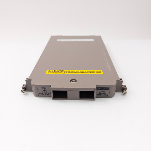 Keithley 7710 scanner module — full front view showing both card-edge connectors and rating plate on tan plastic housing
