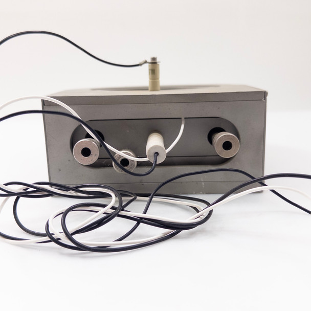 Process chuck – end-on view showing rectangular end face with three tube fittings and bundled black and white wiring