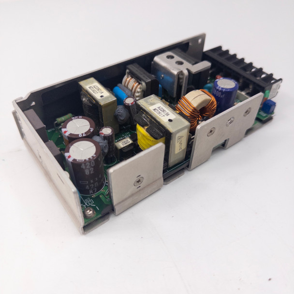 Omron S8VM-15024 power supply – open top view showing full PCB assembly with capacitors, transformers, inductors, and heatsink
