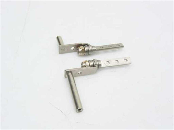 Multimedia 665 left and right LCD screen hinges — close-up showing spring barrel and mounting bracket tabs