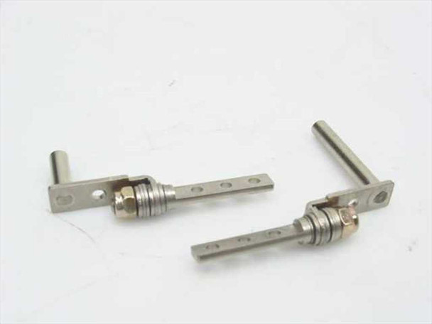 Multimedia 665 LCD hinge pair — angled view showing hinge pivot pin, spring coil, and flat mounting arms
