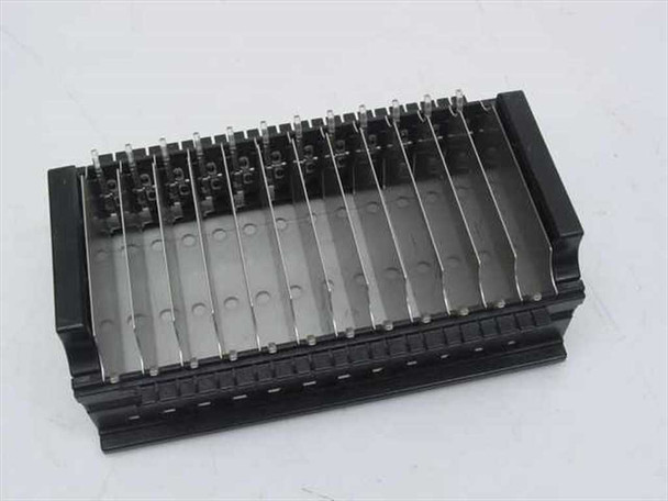 Compaq 29917-002 DAT autoloader 12-slot magazine tray – top-down angled view showing cartridge slot dividers and retainer wire detail
