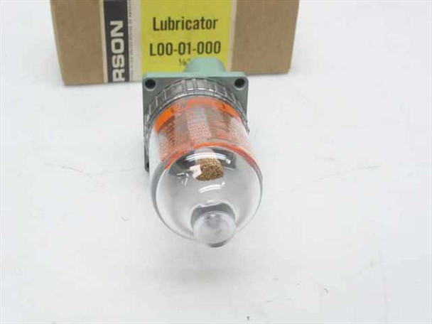 Wilkerson L00-01-000 lubricator top-down view showing port opening, orange seal ring, and clear oil bowl with filter element visible