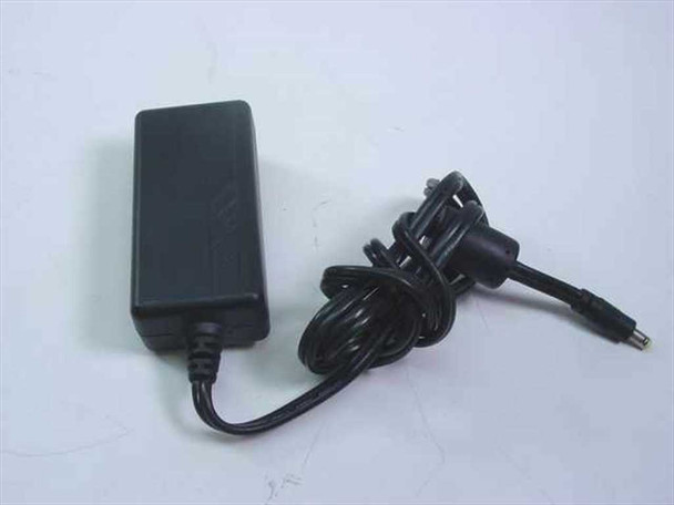 OEM SYS1102-2005 AC adapter – right-side view showing black brick body, coiled DC output cable, and barrel plug connector