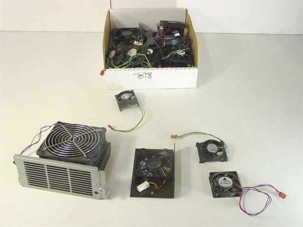 Mixed lot of 12V DC brushless CPU and chassis exhaust cooling fans in cardboard box with several representative units displayed in front, including large heatsink-mounted fan, medium cage-mount fan, and small axial fans