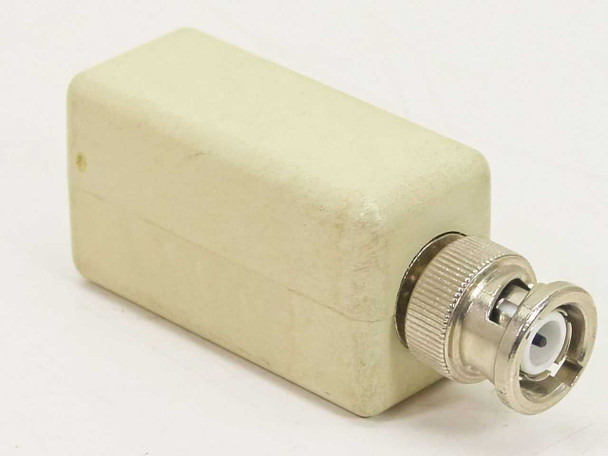 Fibronics FM040-RJM-7 RJ11 to BNC adapter – rear view showing BNC male connector and off-white plastic housing