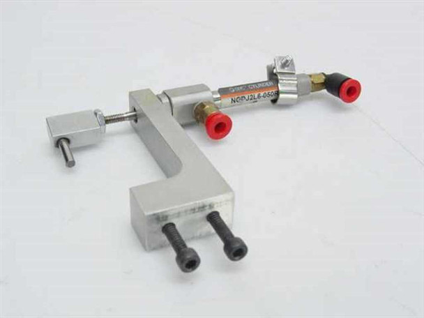 SMC NCDJ2L6-050R-H7A1LS pneumatic cylinder mounted in Poweraire aluminum L-bracket assembly with solenoid valves and push-in fittings — isometric view