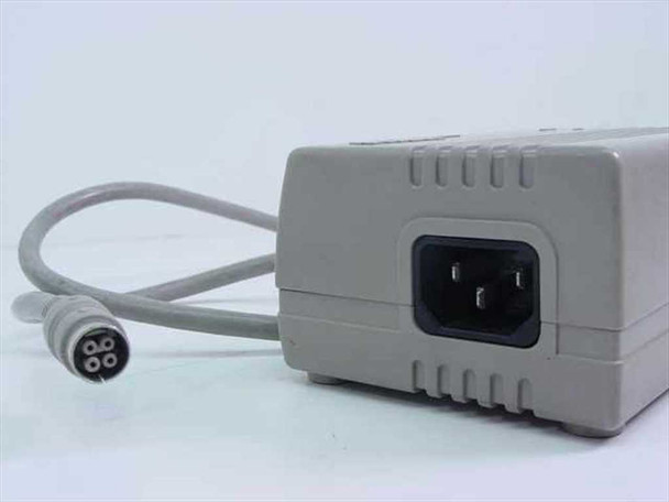 Compaq 118843-004 AC Adapter rear view showing IEC C14 AC inlet and 4-pin DIN output connector end