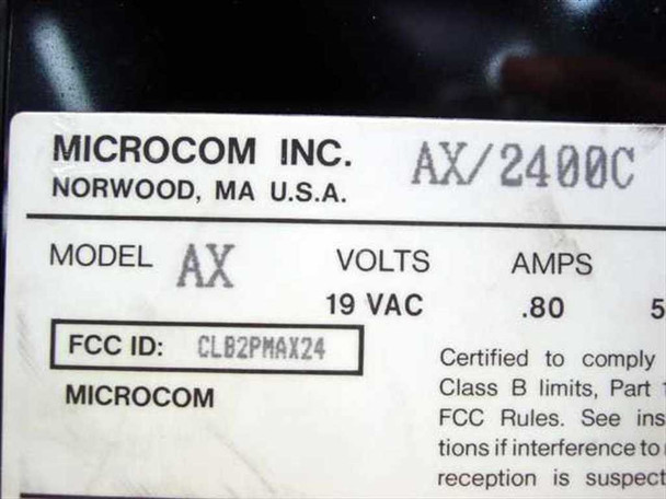 Microcom AX/2400C modem bottom label showing model AX/2400C, 19 VAC 0.80A power specs, and FCC ID CLB2PMAX24