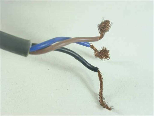 E2K-C25ME1 sensor lead wire ends showing three bare unterminated wires — brown, blue, and black