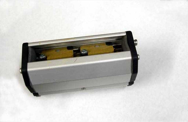Linak LS 22-50 actuator housing bottom view showing internal brass/copper guide rail and switch mounting