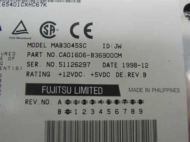Fujitsu MAB3045SC drive label showing model, part number CA01606-B36900CM, serial number, date 1998-12, voltage ratings, and Rev. B