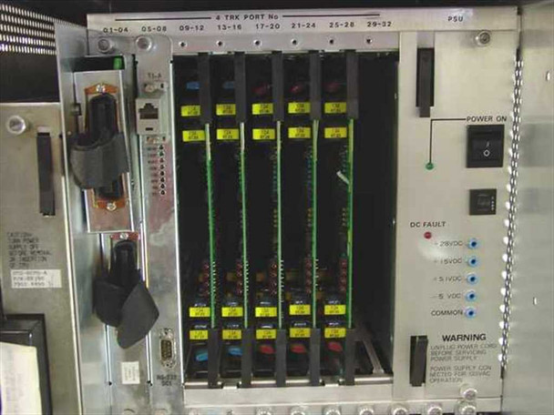 DTS Systems ONYX IV PBX card cage interior showing trunk port headers 01-04 through 29-32, POWER ON switch, and DC fault indicator LEDs