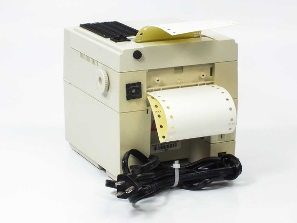 Citizen CBM iDP3530 receipt printer – left-side rear view with tractor feed paper loaded, power switch, and power cord visible