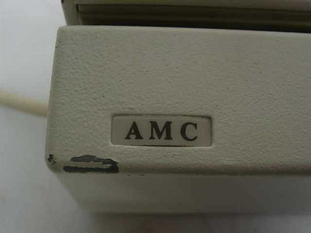 Close-up of AMC brand label on the magnetic card reader housing, showing chip on corner