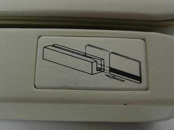Magnetic card reader card-insertion diagram label on top of the AMC 702ETDAI-VR unit