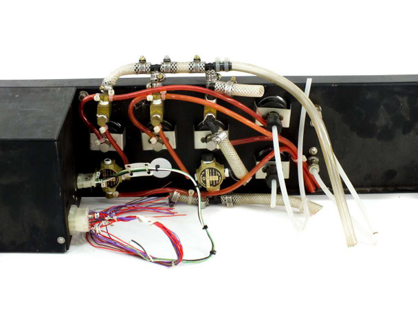 CRD-1410-DF interior rear view showing fluid manifold block, solenoid valves, red and white tubing, and loose wiring harness