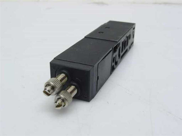Taiyo USR540-MXF pneumatic block manifold — close-up of black polymer body and two stainless steel threaded port fittings