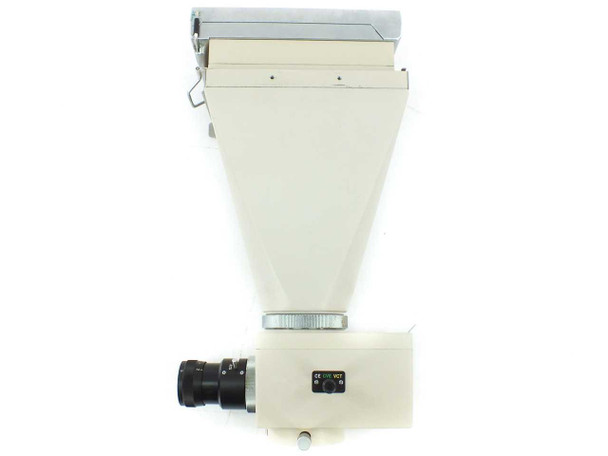Olympus PM-10AD photomicrography camera — front view showing camera lens port, color filter indicator, and Polaroid back attached