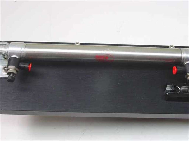 Stelron Bimba DS3-6-C – closeup of stainless steel pneumatic cylinder body with red magnetic position sensor indicators