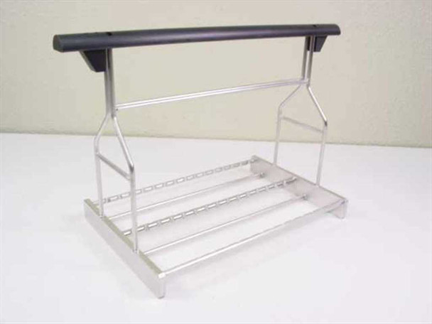 Applied Magnetics Wafer Block Carton Carrier – front three-quarter view showing aluminum wire frame base, angled support arms, and black rubber-grip handle bar