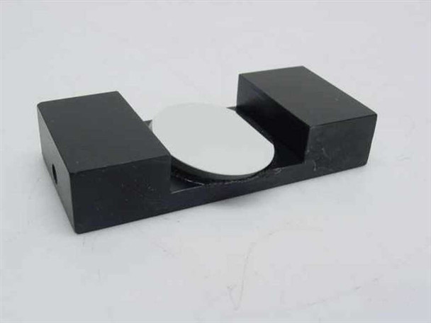 Spindler and Hoyer NL optical mirror alignment clamp – angled side view showing matte black base profile and small access hole on inner wall with mirror disk in place