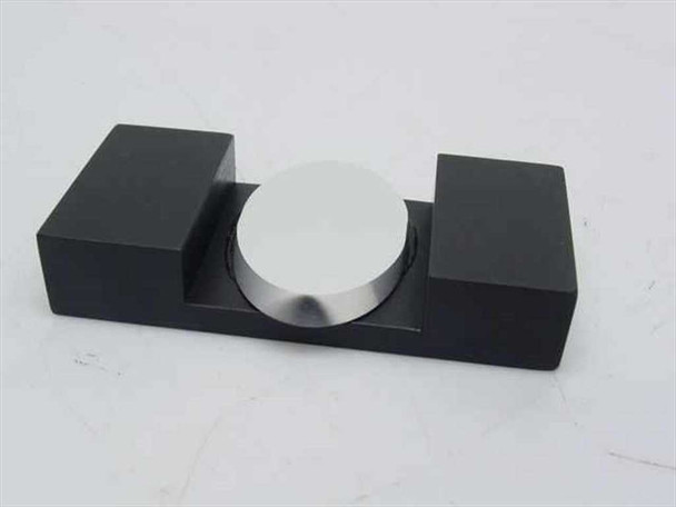 Spindler and Hoyer NL optical mirror fixture clamp – front view showing matte black U-cradle base with circular polished mirror disk seated in centered cutout
