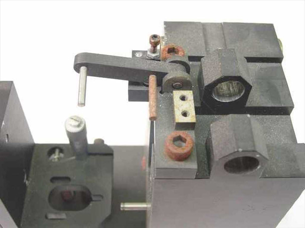Daedal linear slide assembly – close-up of upper clamping and pivot hardware showing surface rust on fasteners and mounting brackets