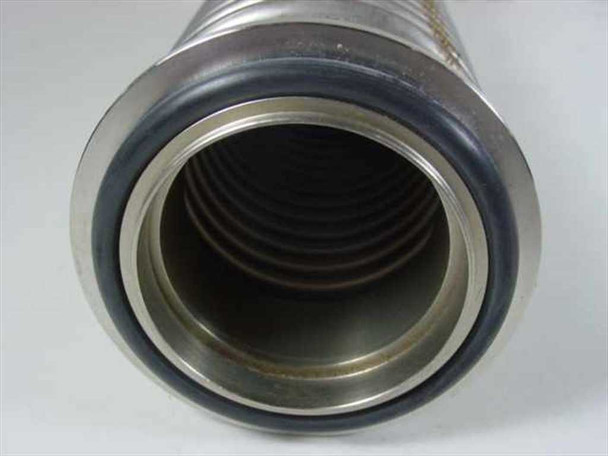 Close-up of MKS HPS vacuum bellows flange end showing 2-inch opening bore and black O-ring seal seated in groove
