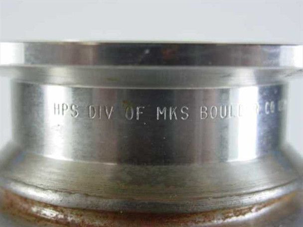 Close-up of MKS HPS vacuum bellows flange showing engraved text reading HPS DIV OF MKS BOUL... (Boulder, CO) manufacturer marking