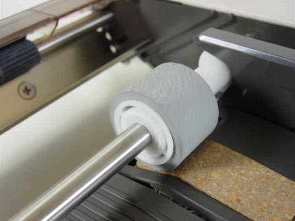 Unisys AP 1337 SF cut sheet feeder close-up of paper feed roller assembly on chrome shaft